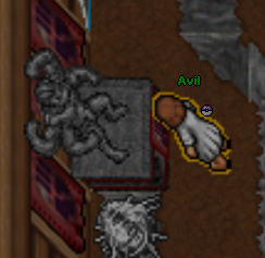 Chegando na 'casinha', você encontrará essa estátua de machamp e você deverá clicar na base da estátua para ir para a próxima fase da quest.